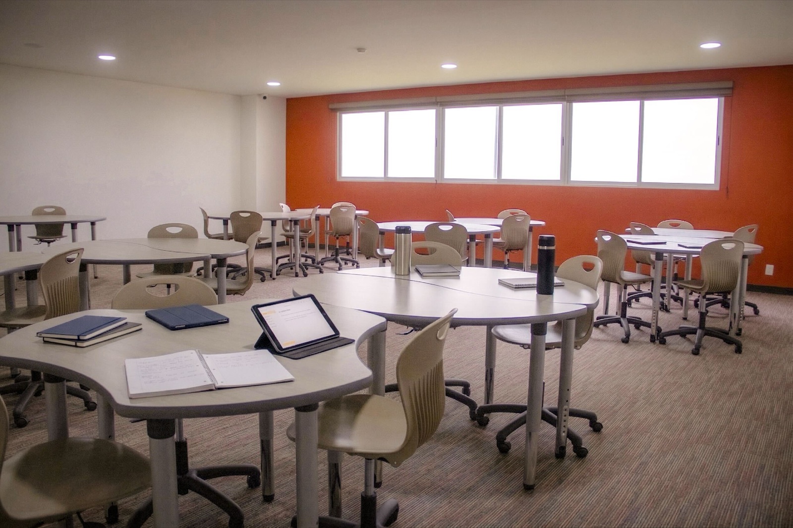 Prepa NWL classroom at Zibata with NWL varsity jackets and iPads